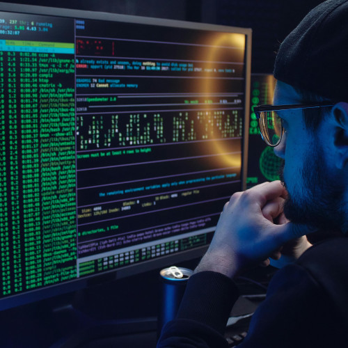 a man working on a computer in cybersecurity